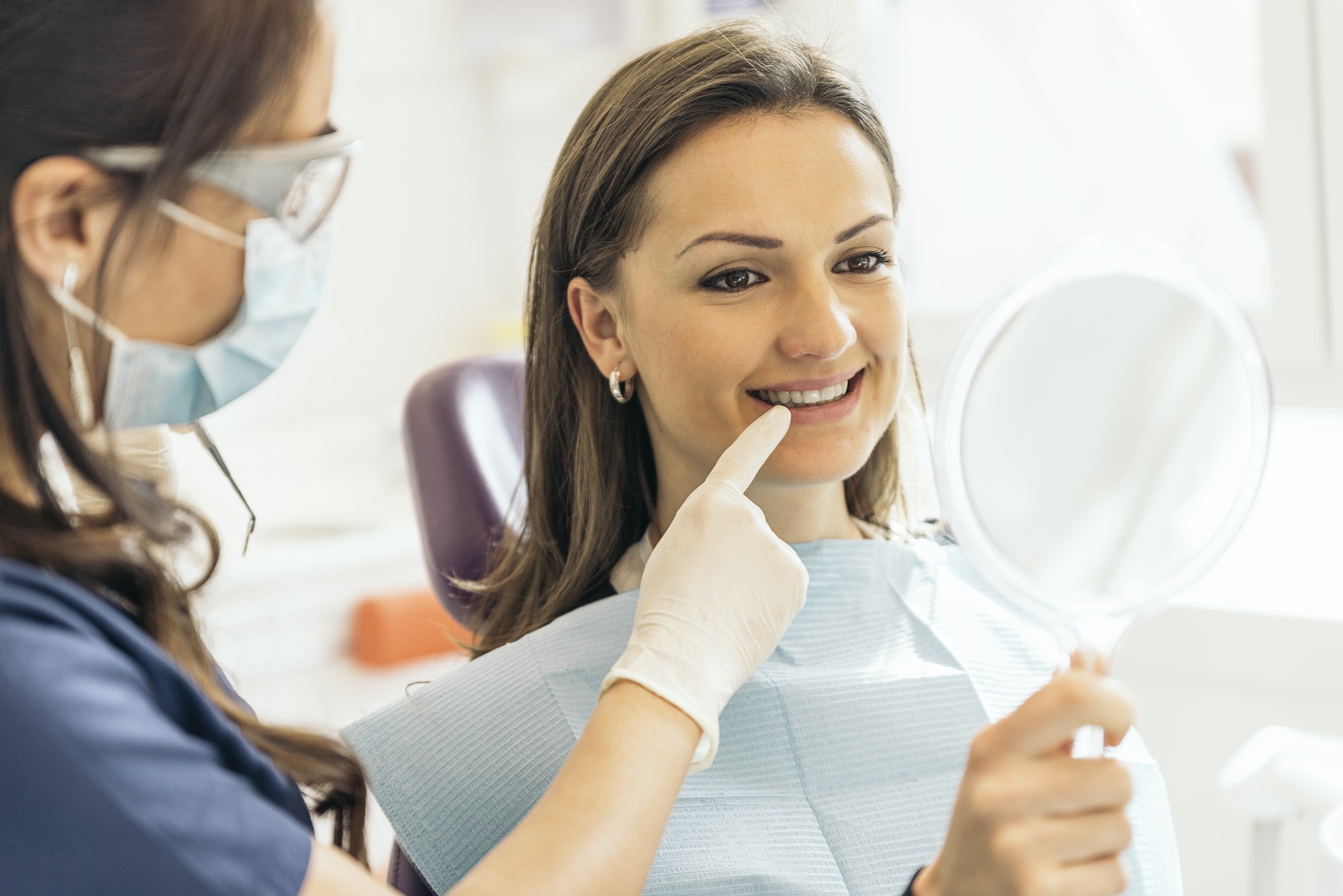 Dentists with a patient during a dental intervention